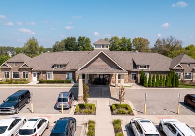Exterior view of Volante Senior Living facility with parking lot