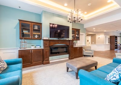 Cozy common area with comfortable seating and TV.