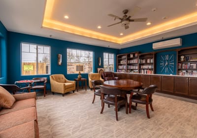 Common area with seating and bookshelf.