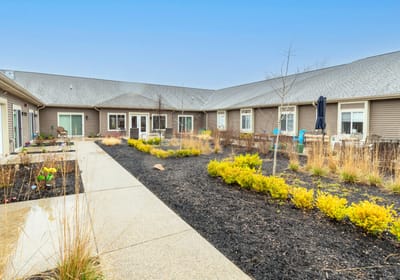Pathway through landscaped garden area at the facility.