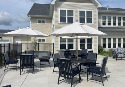 Outdoor patio area with tables and umbrellas
