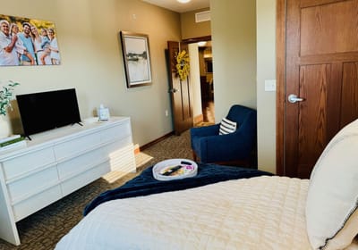 Cozy interior of a senior living room with amenities.