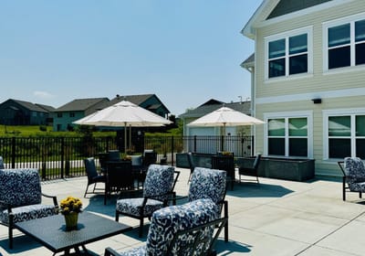 Outdoor patio area with seating and umbrellas