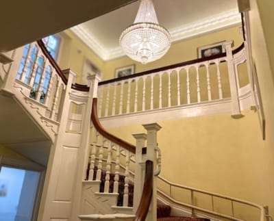 Elegant interior staircase with chandelier