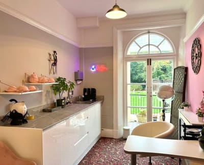 Bright interior with a cozy area and a large window view