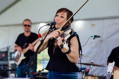 Musician performing at an outdoor event
