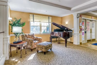 Interior common area with a grand piano and seating
