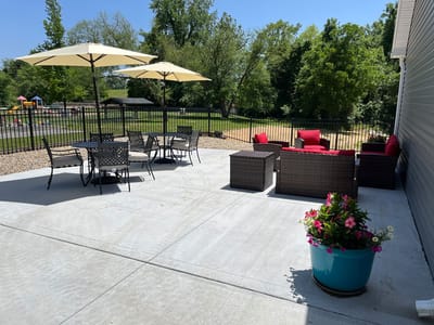 Outdoor seating area with tables and umbrellas