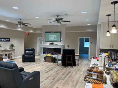 Bright common area with seating and snacks available