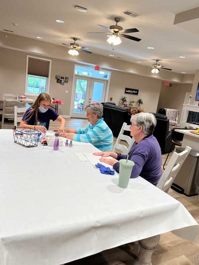 Residents and a staff member engaged in an activity
