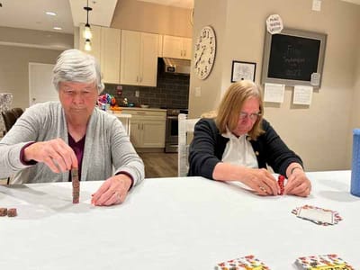 Residents engaging in a game activity indoors