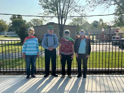 Residents in capes and silly glasses enjoying outdoor activities