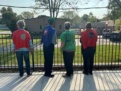 Residents dressed as superheroes enjoying the outdoors