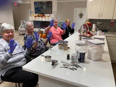 Residents participating in a cooking activity in the kitchen