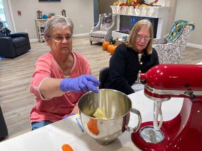 Residents baking together in a common area