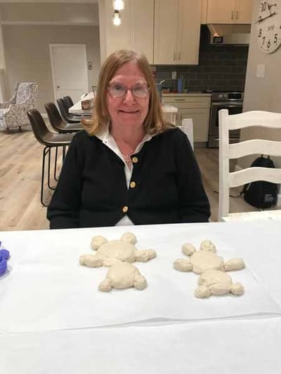 Resident engaged in a crafting activity with dough figures