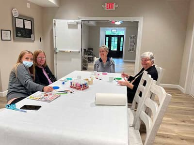 Residents and staff participating in an art activity