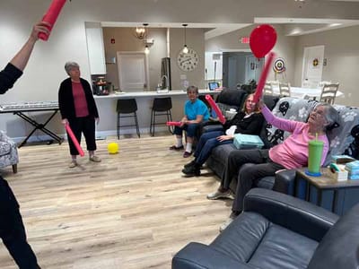 Residents engaging in an activity inside the facility