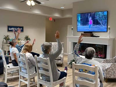 Residents participating in an activity in a cozy common area