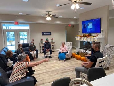 Residents engaging in a group activity in a common area