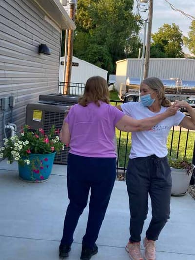 Residents enjoying dance activity outdoors