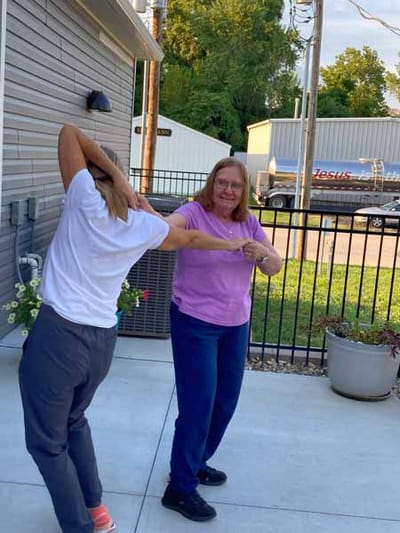 Residents dancing in an outdoor space