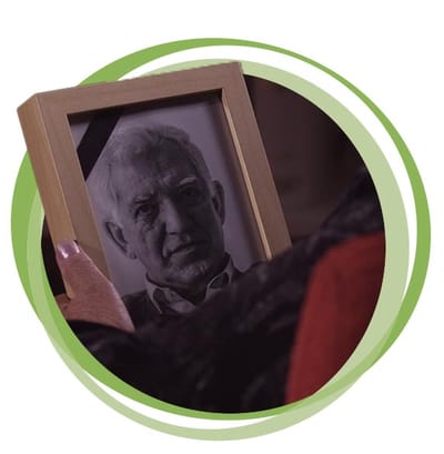 Person holding a framed photograph