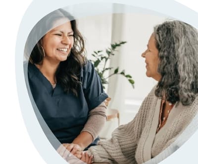 Gentiva Hospice – Tucson, home care in Tucson, AZ — Caregiver and senior resident sharing a joyful conversation