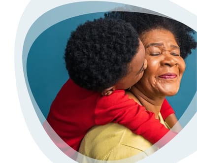 Gentiva Hospice – Tucson, home care in Tucson, AZ — Child hugging an elderly woman with joyful expressions