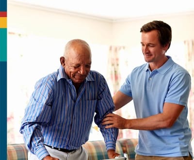 Gentiva Hospice – Tucson, home care in Tucson, AZ — Caregiver assisting an elderly man in a home setting