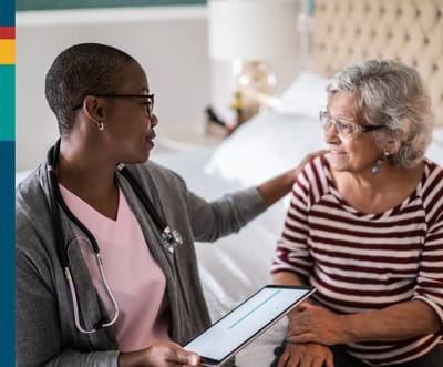 Gentiva Hospice – Tucson, home care in Tucson, AZ — Healthcare professional interacting with a senior resident