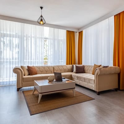 Modern living room with natural light and soft decor