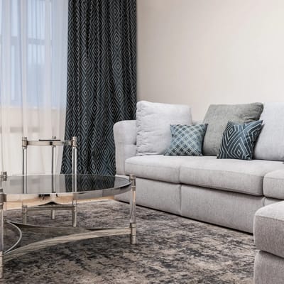 Modern living room with couch and coffee table.