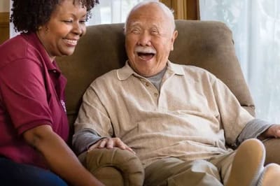 Salus Home Care, home care in San Diego, CA — Caregiver interacting joyfully with an elderly resident
