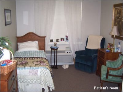 Cozy resident room with furniture and personal items