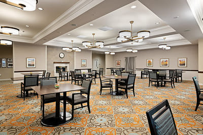 Empty common area with tables and chairs