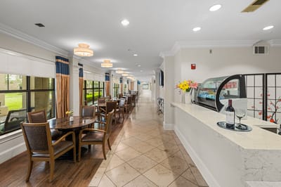 Interior view of the dining area with tables and flowers