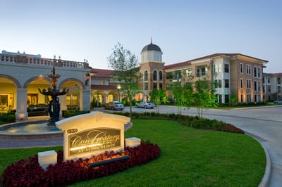 Exterior view of Conservatory at Alden Bridge at twilight