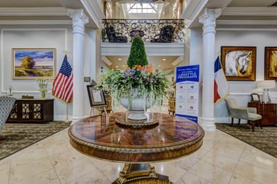 Bright interior lobby with floral arrangement and decor