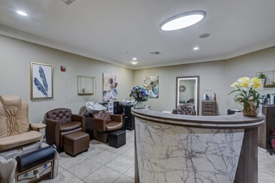 Interior of a beauty salon with comfortable chairs and flower decor