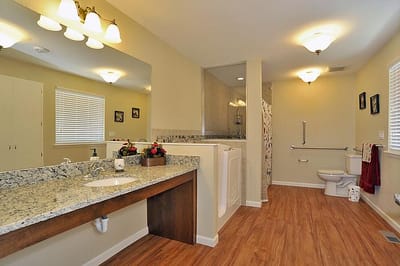A well-lit bathroom with accessible features