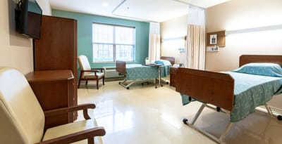 Interior view of a resident room with two beds