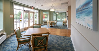 Bright common area with tables and chairs
