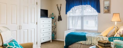 Cozy resident room with bed and storage