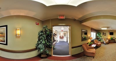Interior hallway view with seating and plants
