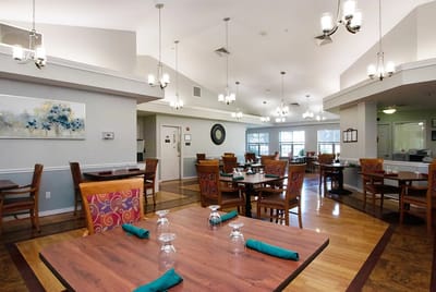 Dining room with tables and chairs set for meals