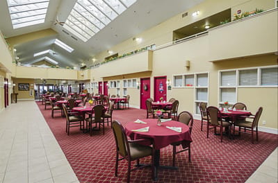 Interior dining area with tables and red decor