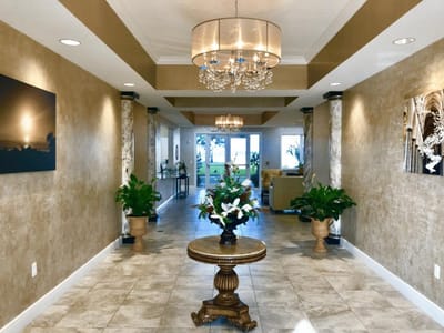 Bright and welcoming lobby area with plants and decor