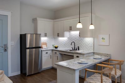 Modern kitchen interior with granite countertops and appliances