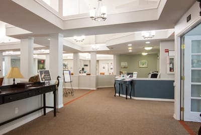 Bright common area with reception and seating